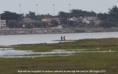 Boat on north salt-marsh at high tide